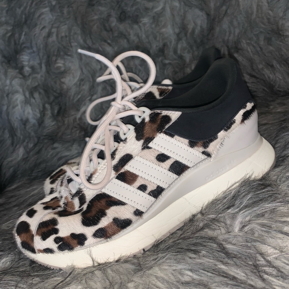 Adidas cheetah/leopard print tennis shoes.